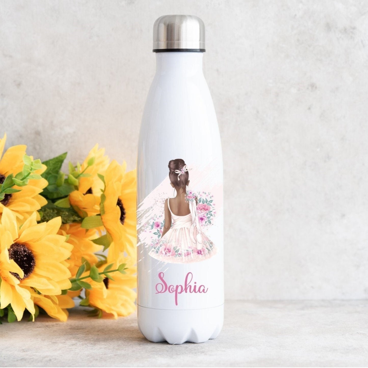A white, uniquely shaped water bottle with a watercolor print of a ballerina in a floral tutu, accompanied by the name 'Sophia'.