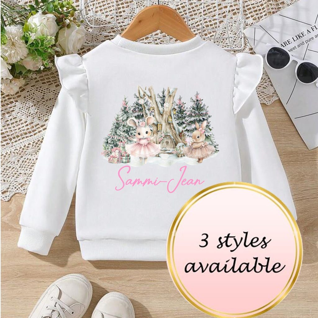 White sweatshirt with a Christmas design on a wooden surface, with text indicating '3 styles available'.