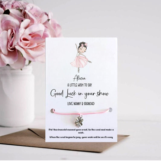 Card with a bracelet and flowers on a white background