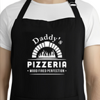 Black apron with 'Daddy's Pizzeria' text and graphic worn by a person.