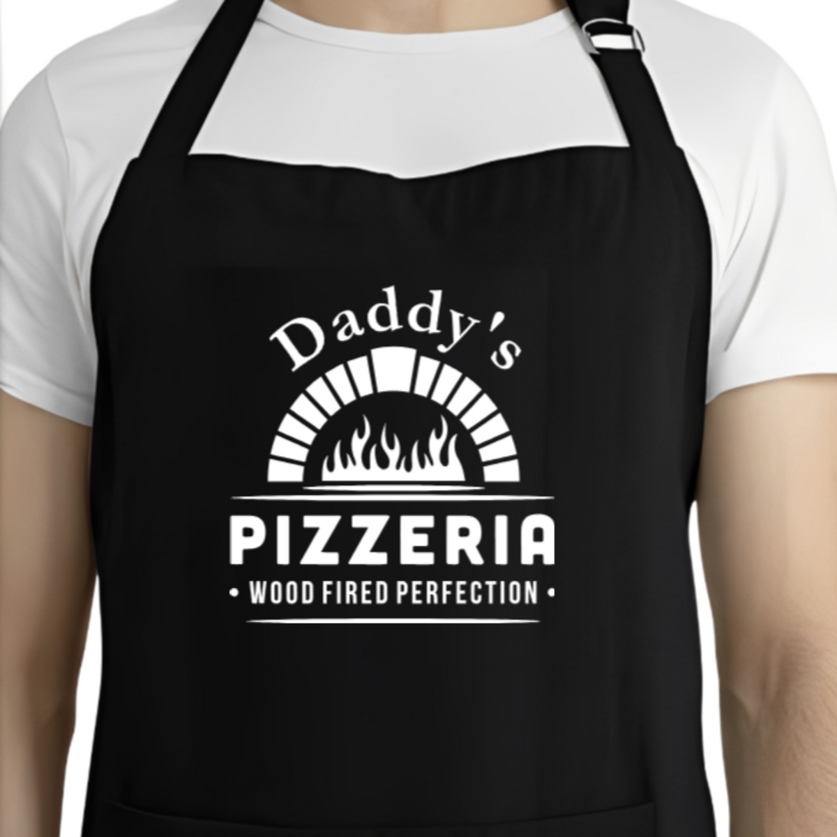 Black apron with 'Daddy's Pizzeria' text and graphic worn by a person.