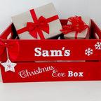 Red Christmas Eve Box' with gifts and bows on a white background