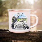 White mug with golf-themed design on a wooden surface with a blurred natural background