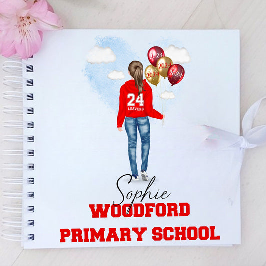 A personalized white scrapbook with a custom illustration of a girl in a red sweater on the cover, along with text personalizations including a name and school name.