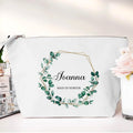 White pouch with green leaf design and 'Joanna Maid of Honour' text on a white background