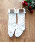 personalised Cream Knit Christmas Stocking with Leather Tag