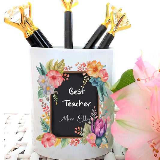 Pencil holder with floral design and 'Best Teacher' text on a white background