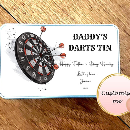 Personalized dart tin for Father's Day on a wooden surface with a hand holding a 'Customise me' button.
