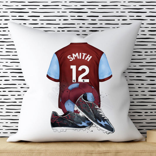Pillow with a soccer jersey and cleats design on a white background