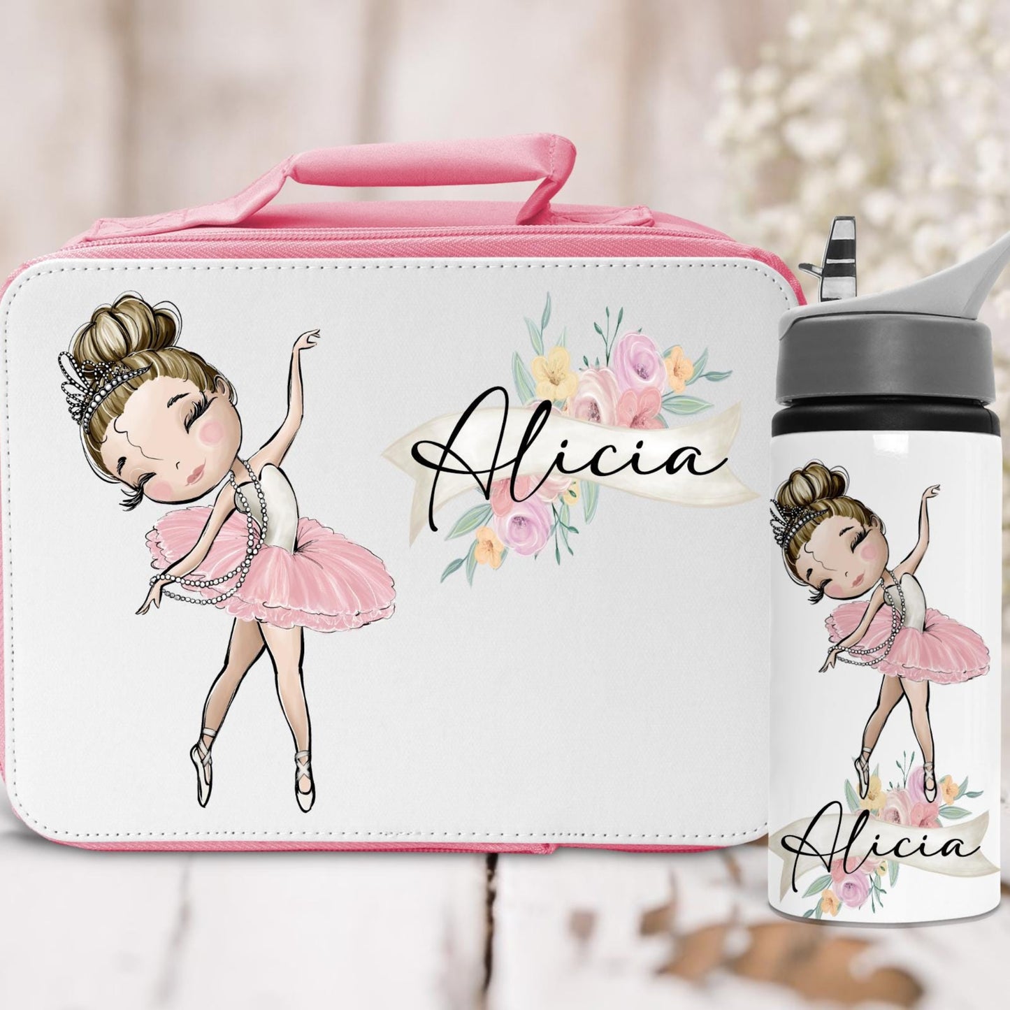 Lunch box and water bottle set with ballerina design and 'Alicia' text on a light background.