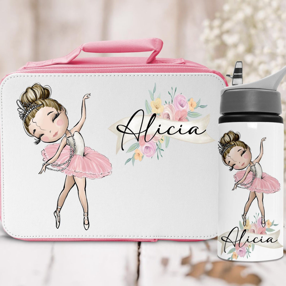 Lunch box and water bottle set with ballerina design and 'Alicia' text on a light background.