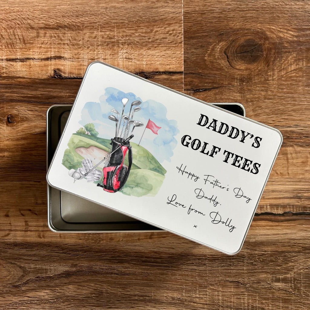 Golf-themed gift tin with 'Daddy's Golf Tees' text on a wooden surface