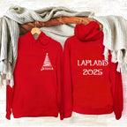 Two red hoodies with personalized text on a wooden surface with a blanket.