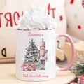White mug with pink handle featuring a Christmas design and the text 'Sammi's Hot chocolate mug'.