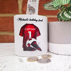 Personalised red football team money box, red football shirt piggy bank, football team colours money pot