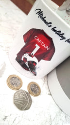 Personalised red football team money box, red football shirt piggy bank, football team colours money pot