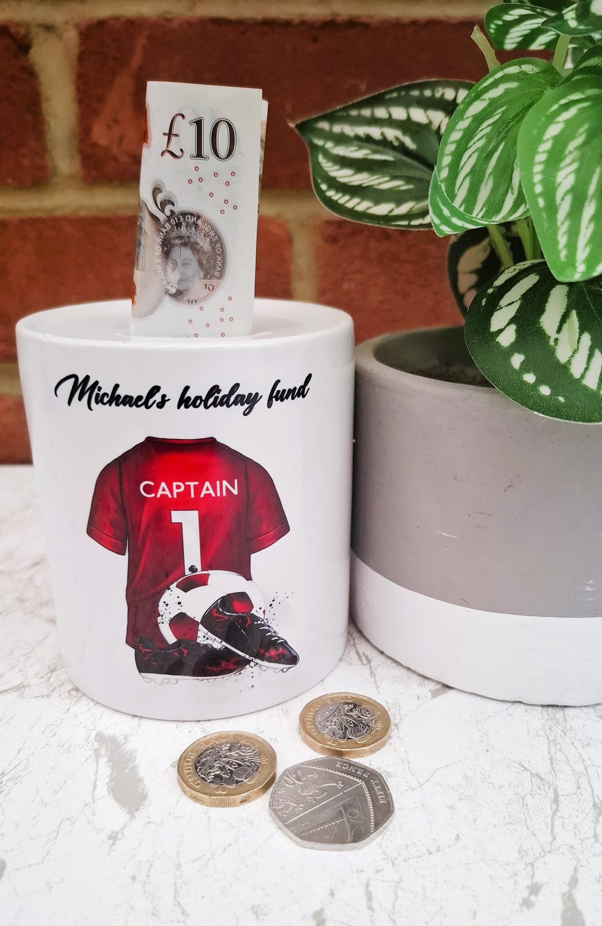 Personalised red football team money box, red football shirt piggy bank, football team colours money pot
